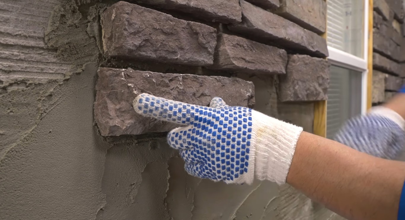 Professional masonry contractor working on brick repair in Mobile, AL
